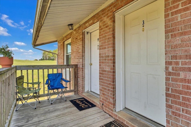 14189 Franklin St, Ferrum, VA 24088 - doorway to property with a wooden deck and brick siding
