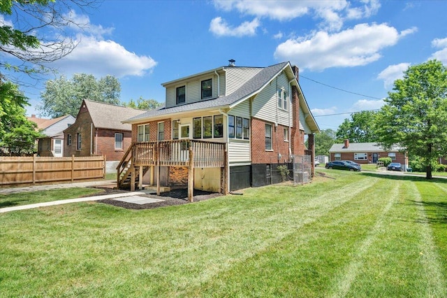 back of property featuring brick siding, stairs, a wooden deck, and a shingled roof