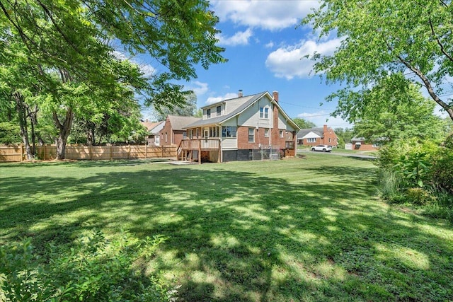 back of house featuring a chimney and brick siding