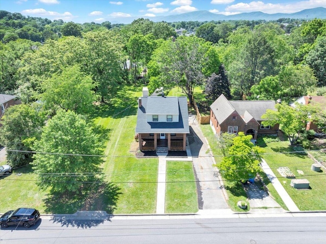 view from above of property with a forest
