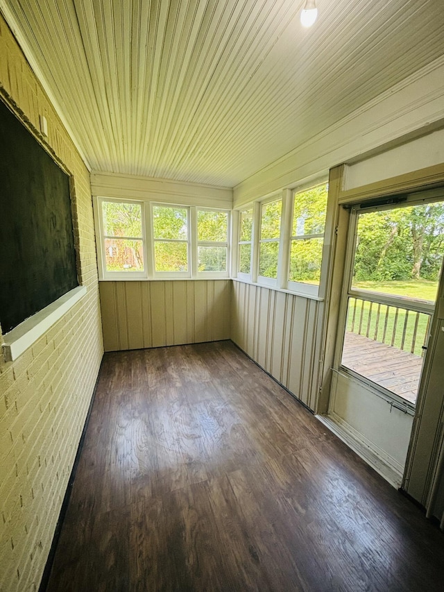 unfurnished sunroom with wood finished floors