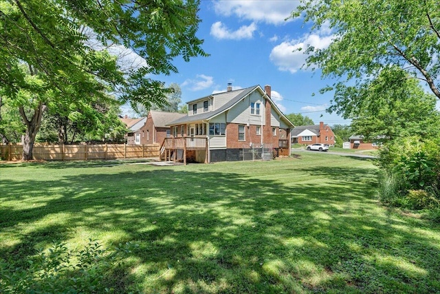 back of property with a chimney