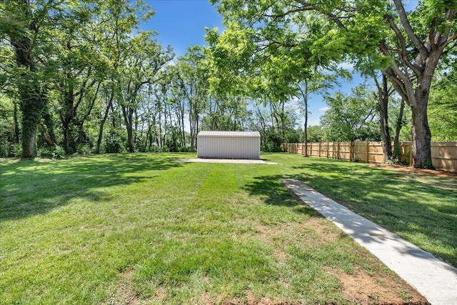 view of yard with an outdoor structure and a storage unit