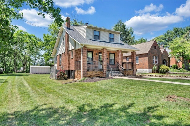 view of front of home with a porch, a chimney, a front lawn, brick siding, and roof with shingles