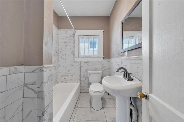4 14th St SW, Roanoke, VA 24016 - bathroom featuring toilet and tile walls