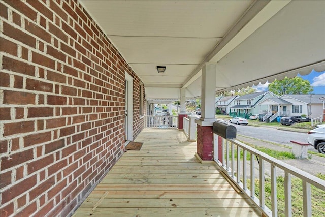 4 14th St SW, Roanoke, VA 24016 - wooden deck featuring a porch and a residential view