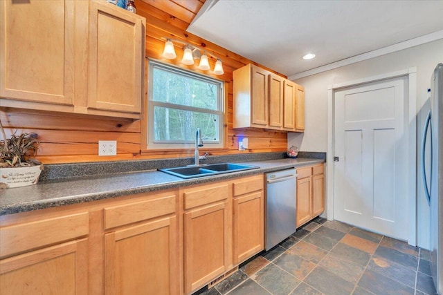 kitchen with stainless steel appliances, light brown cabinetry, a sink, and dark countertops