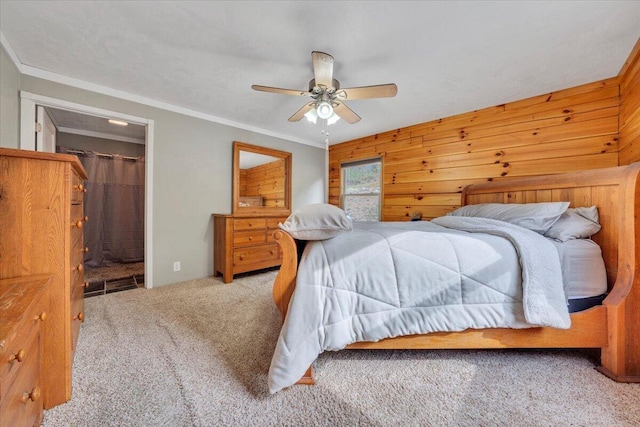 carpeted bedroom with ceiling fan and ornamental molding