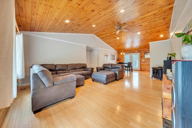 living room with vaulted ceiling, wooden ceiling, light wood-type flooring, crown molding, and ceiling fan