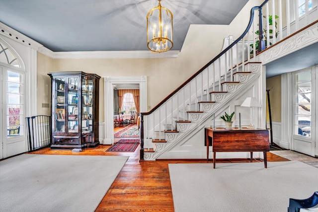 420 S Church St, Fincastle, VA 24090 - entrance foyer featuring healthy amount of natural light, wood finished floors, a chandelier, stairs, and crown molding