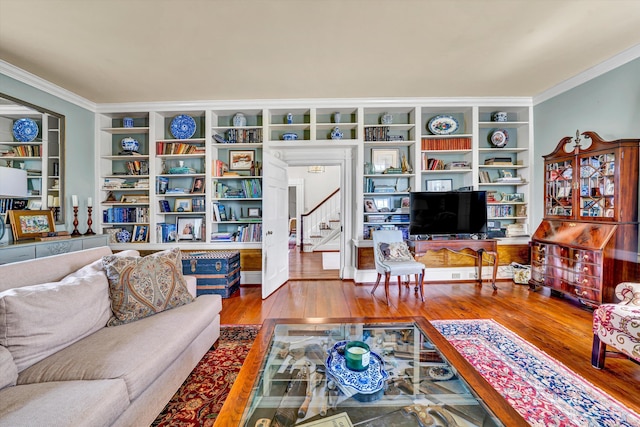 420 S Church St, Fincastle, VA 24090 - living area featuring ornamental molding, stairway, wood finished floors, and built in shelves