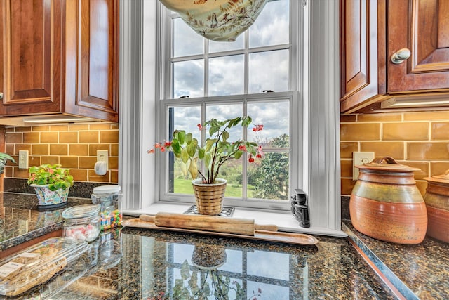 420 S Church St, Fincastle, VA 24090 - kitchen view of backsplash, brown cabinets, and dark stone countertops