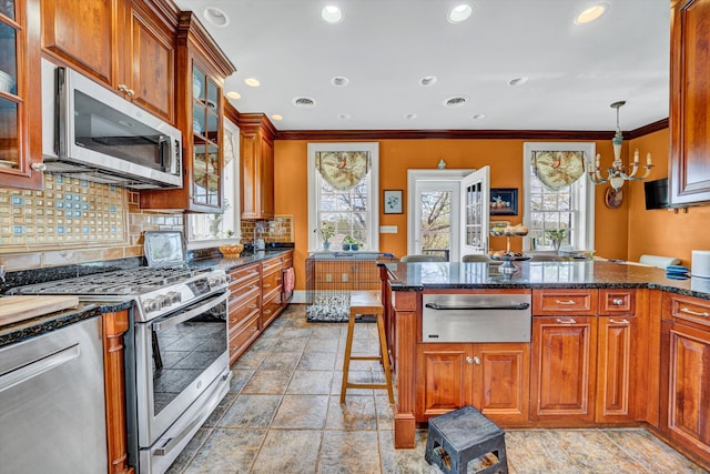 420 S Church St, Fincastle, VA 24090 - kitchen with appliances with stainless steel finishes, a warming drawer, plenty of natural light, ornamental molding, and stone tile floors