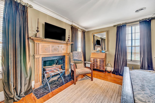 420 S Church St, Fincastle, VA 24090 - bedroom featuring crown molding, a fireplace, wood finished floors, and baseboards