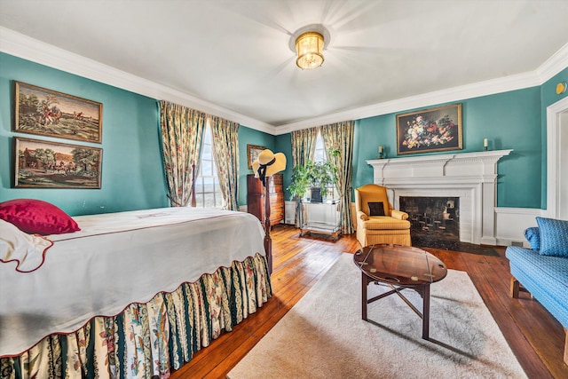 420 S Church St, Fincastle, VA 24090 - bedroom with ornamental molding, hardwood / wood-style floors, and a fireplace with flush hearth