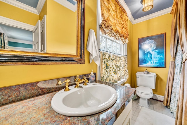 420 S Church St, Fincastle, VA 24090 - bathroom with toilet, ornamental molding, tile patterned floors, vanity, and baseboards