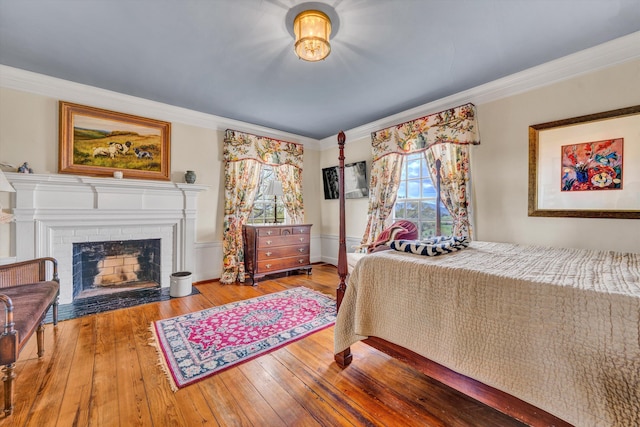 420 S Church St, Fincastle, VA 24090 - bedroom with crown molding, hardwood / wood-style flooring, and a fireplace with flush hearth