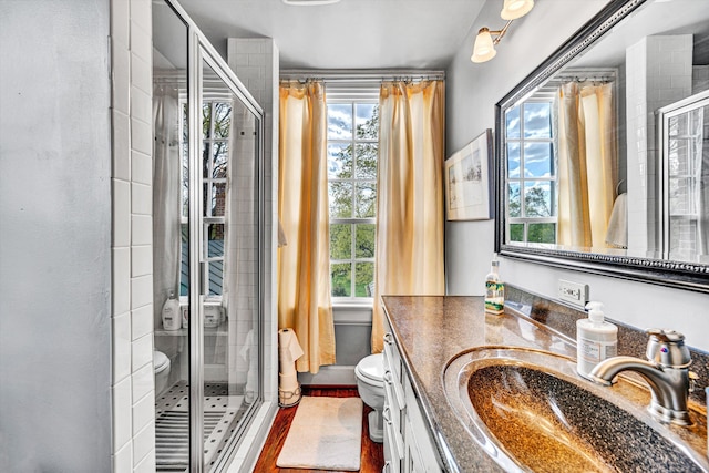 420 S Church St, Fincastle, VA 24090 - full bath featuring toilet, vanity, a shower stall, and wood finished floors