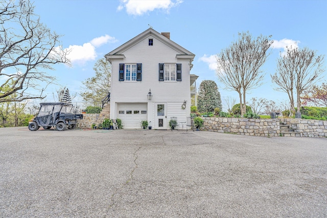 420 S Church St, Fincastle, VA 24090 - view of side of home with a chimney and a garage