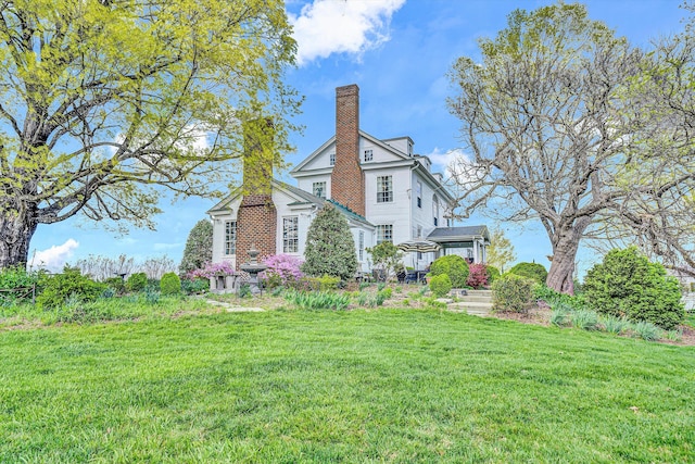 420 S Church St, Fincastle, VA 24090 - view of property exterior featuring a yard and a chimney