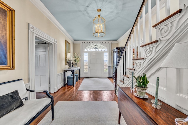 420 S Church St, Fincastle, VA 24090 - entrance foyer with dark wood-type flooring, stairs, ornamental molding, and a chandelier