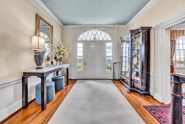 420 S Church St, Fincastle, VA 24090 - foyer featuring wood finished floors, a decorative wall, crown molding, and a wainscoted wall