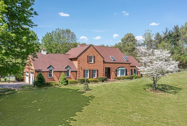 2902 Brughs Mill Rd, Fincastle, VA 24090 - view of front of home featuring a front yard, a garage, brick siding, driveway, and a chimney