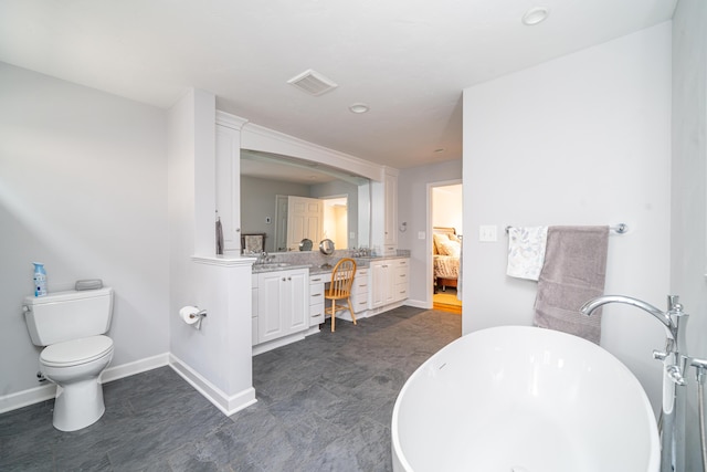 2902 Brughs Mill Rd, Fincastle, VA 24090 - bathroom featuring visible vents, toilet, a freestanding tub, vanity, and ensuite bath