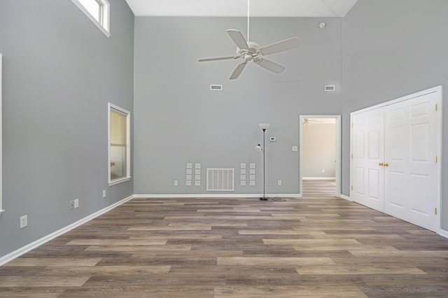 2902 Brughs Mill Rd, Fincastle, VA 24090 - unfurnished living room with visible vents, high vaulted ceiling, a ceiling fan, and baseboards