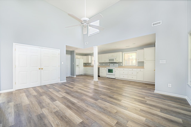 2902 Brughs Mill Rd, Fincastle, VA 24090 - unfurnished living room with a ceiling fan, high vaulted ceiling, baseboards, and light wood-style floors