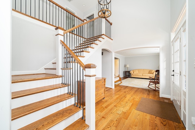 2902 Brughs Mill Rd, Fincastle, VA 24090 - entryway with arched walkways, wood finished floors, baseboards, stairway, and a towering ceiling