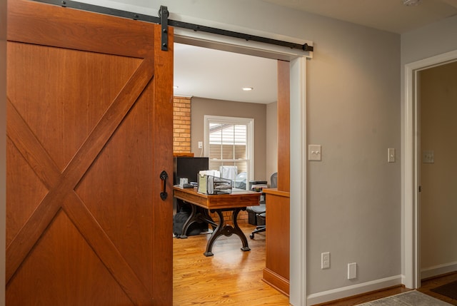 2902 Brughs Mill Rd, Fincastle, VA 24090 - office area with baseboards, a barn door, and light wood-style flooring