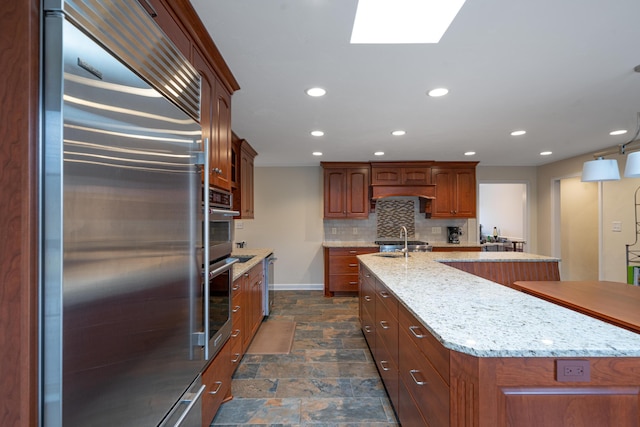 2902 Brughs Mill Rd, Fincastle, VA 24090 - kitchen with recessed lighting, stone finish flooring, built in refrigerator, tasteful backsplash, and a center island with sink