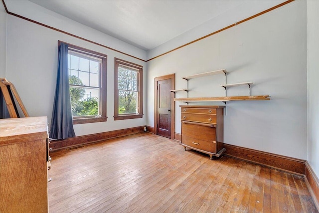 interior space with visible vents, baseboards, and light wood-style floors