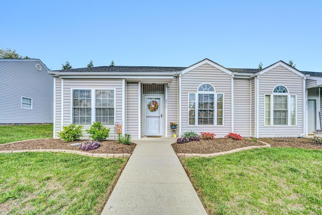 ranch-style house featuring a front yard