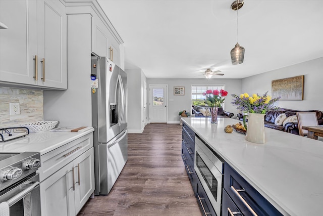 1410 Flowing Springs Rd, Buchanan, VA 24066 - kitchen featuring appliances with stainless steel finishes, light countertops, a ceiling fan, backsplash, and pendant lighting