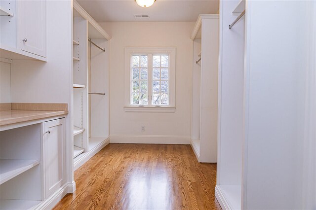 2912 Wycliffe Ave SW, Roanoke, VA 24014 - walk in closet featuring light wood-style floors and visible vents
