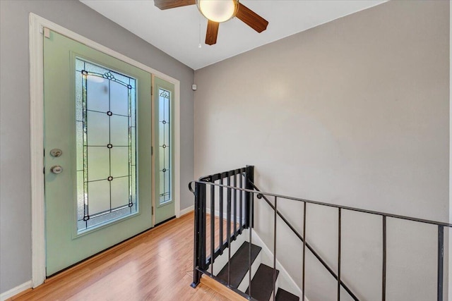 entrance foyer featuring baseboards, light wood-type flooring, and ceiling fan