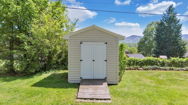 view of shed featuring a mountain view