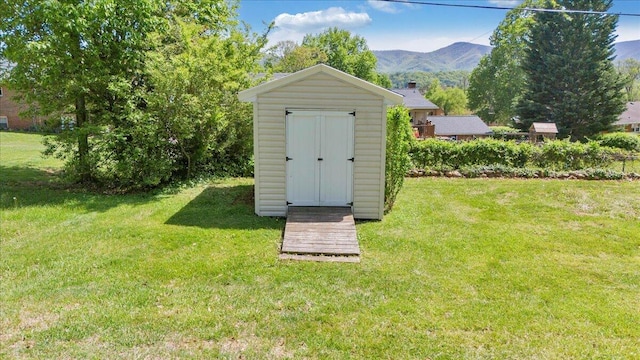 view of shed featuring a mountain view