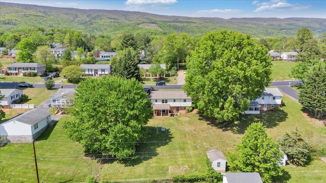 aerial view featuring a mountain view, a forest view, and a residential view