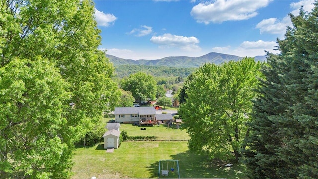 birds eye view of property featuring a mountain view