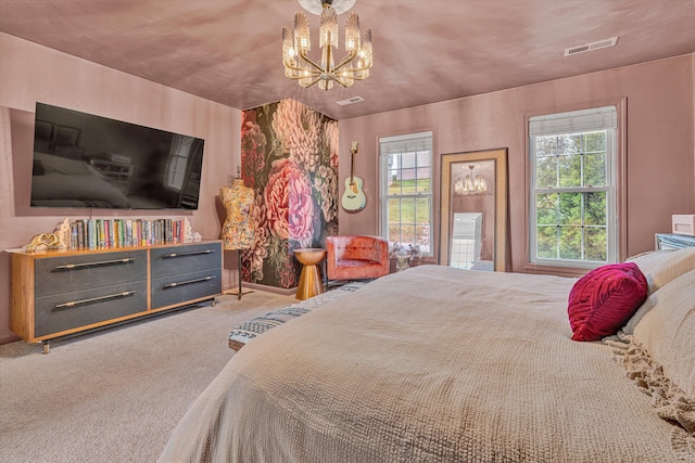 carpeted bedroom with an inviting chandelier and visible vents