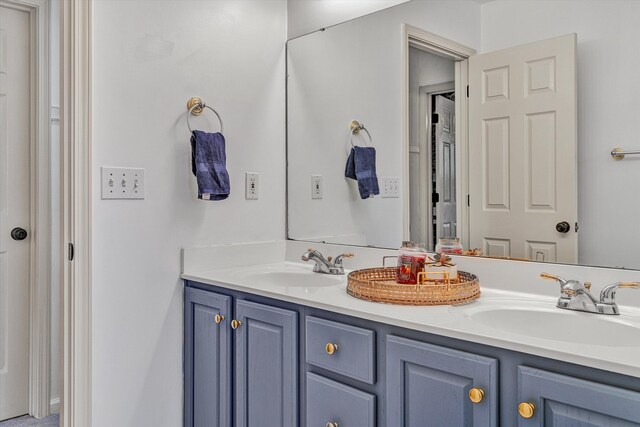 bathroom featuring double vanity and a sink