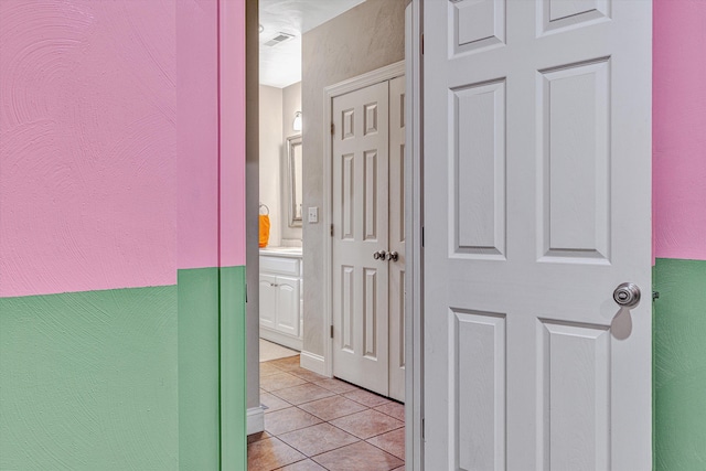 corridor featuring light tile patterned flooring