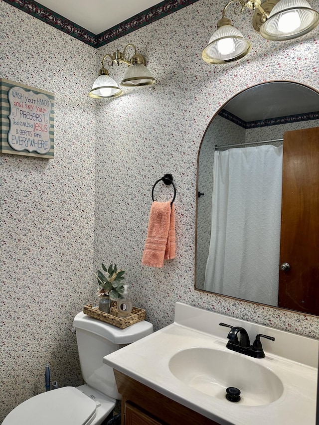full bathroom featuring toilet and vanity