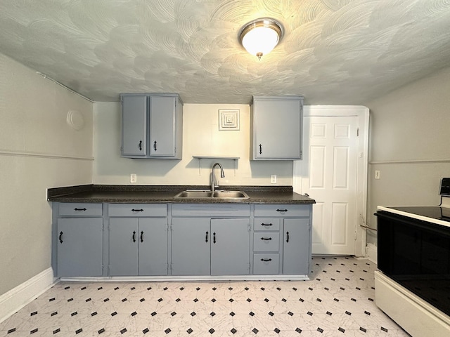 1414 Wise Ave SE, Roanoke, VA 24013 - kitchen featuring range with electric cooktop, gray cabinetry, a sink, and baseboards