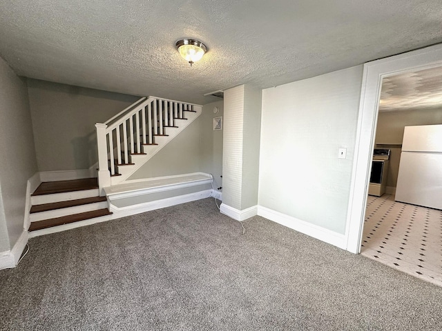 1414 Wise Ave SE, Roanoke, VA 24013 - below grade area featuring freestanding refrigerator, stairway, a textured ceiling, carpet flooring, and baseboards