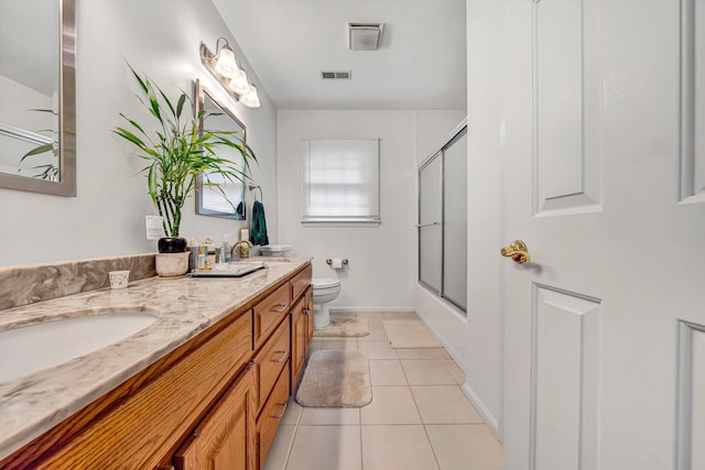 72 Windsor Ct, Roanoke, VA 24019 - full bathroom featuring toilet, double vanity, combined bath / shower with glass door, tile patterned flooring, and baseboards