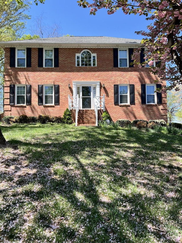 72 Windsor Ct, Roanoke, VA 24019 - colonial inspired home featuring a front yard and brick siding